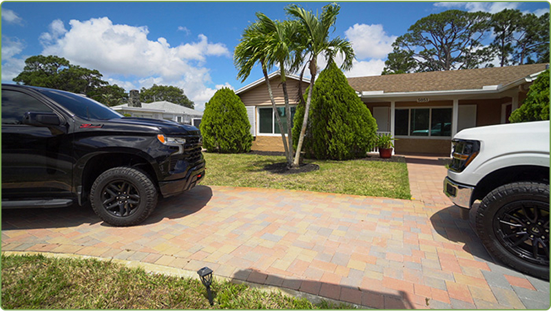 Acceptance House exterior with palm trees